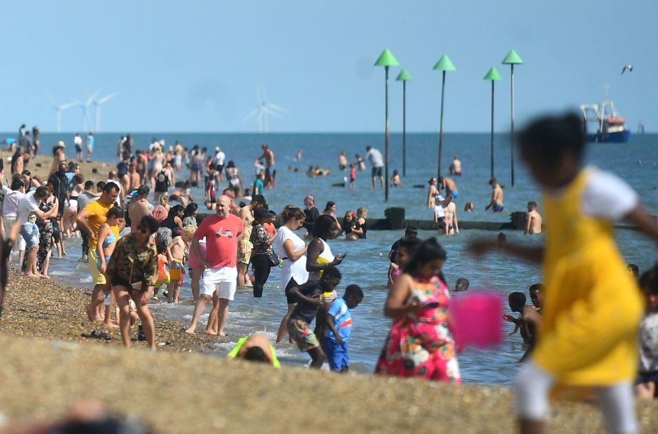 People on the beach at Southend as the hot weather continues