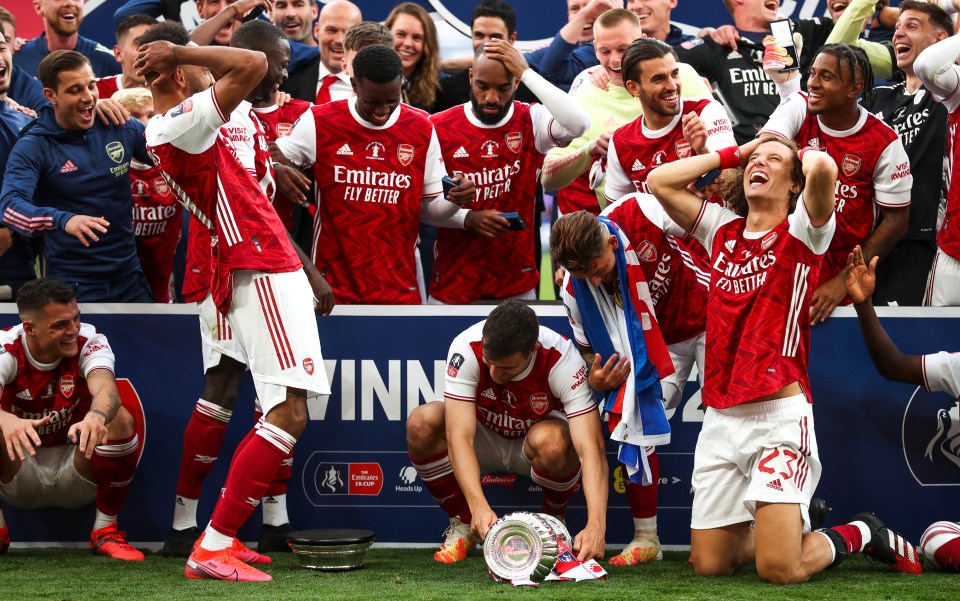 Aubameyang scored twice but dropped the trophy during the celebrations