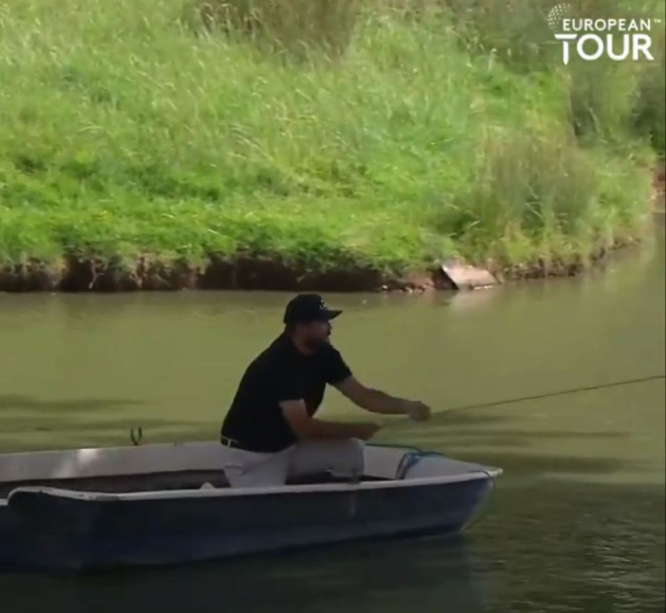 The golfer had to reach the island by pulling on a rope