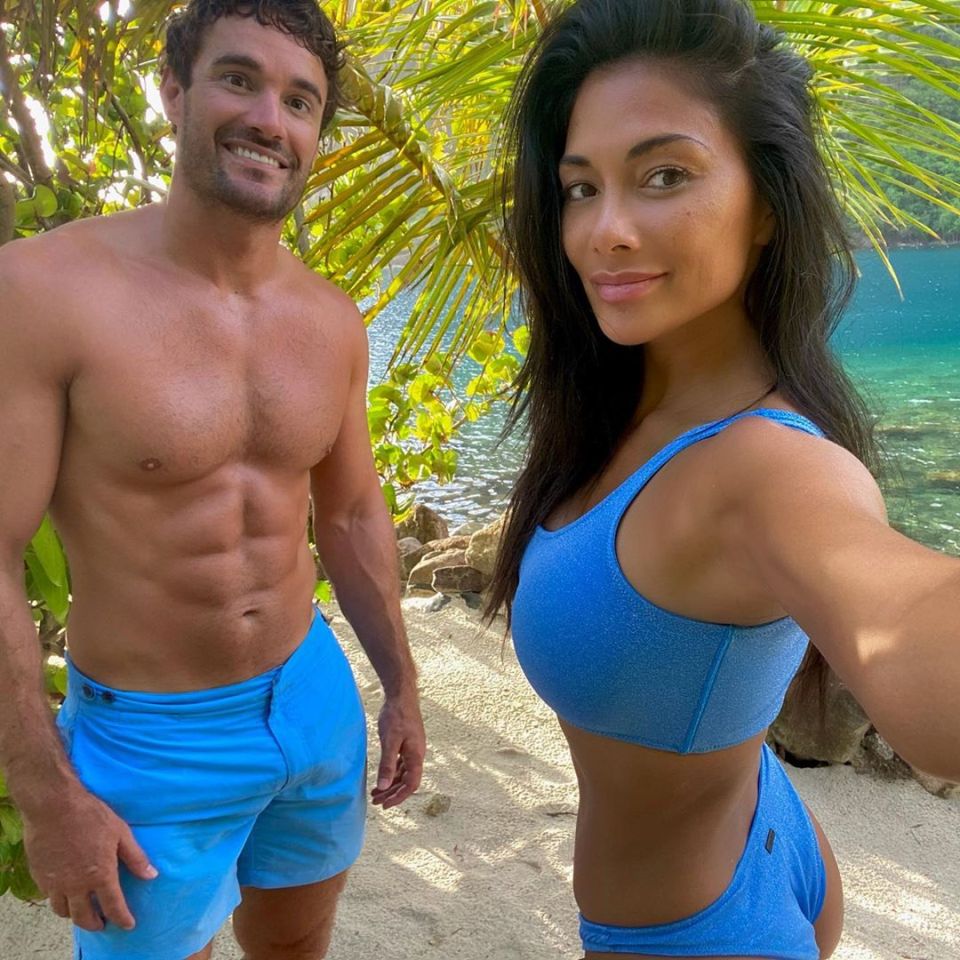  Thom Evans left little to the imagination in his tight swim shorts as he posed with girlfriend Nicole Scherzinger