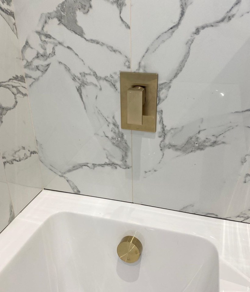 Gold detailing on the sink adds an expensive look