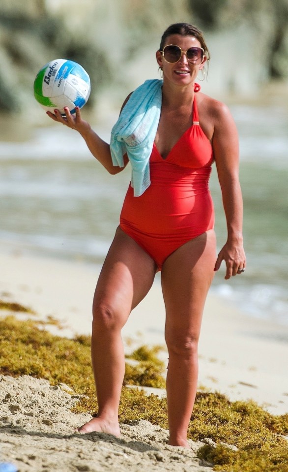 The mum-of-four was wearing a bright-red swimsuit