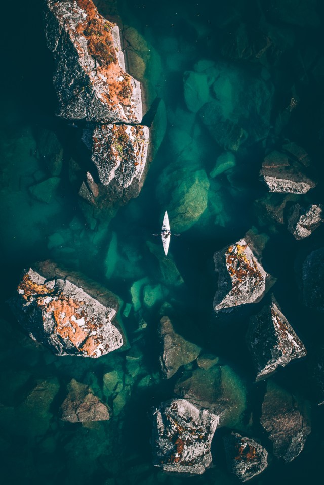 A kayaker on the water from above