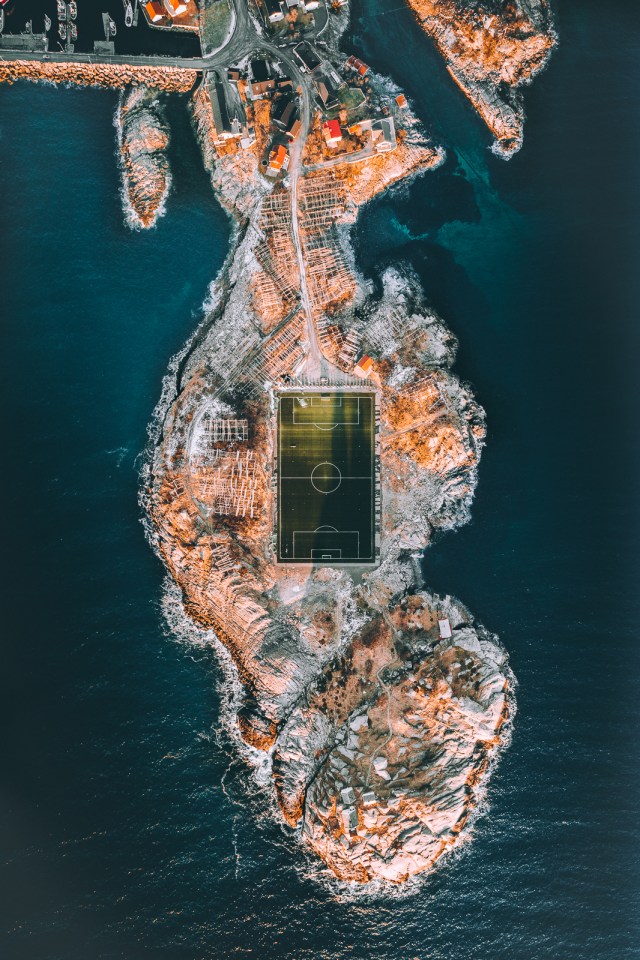 A football field shines during a sunset on the Lofoten Islands in Norway