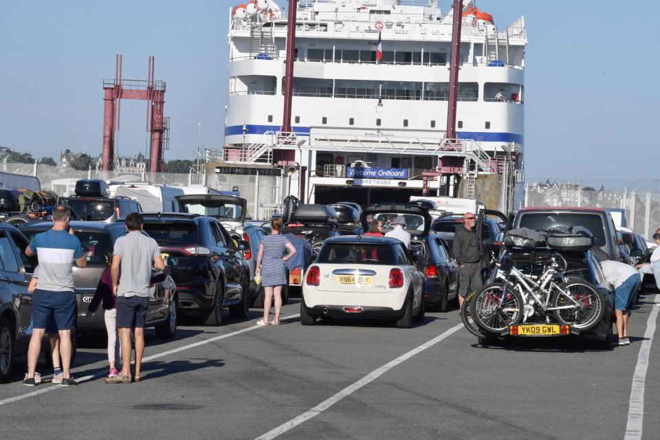 English Tourists at St Malo wait to catch the ferry home this morning