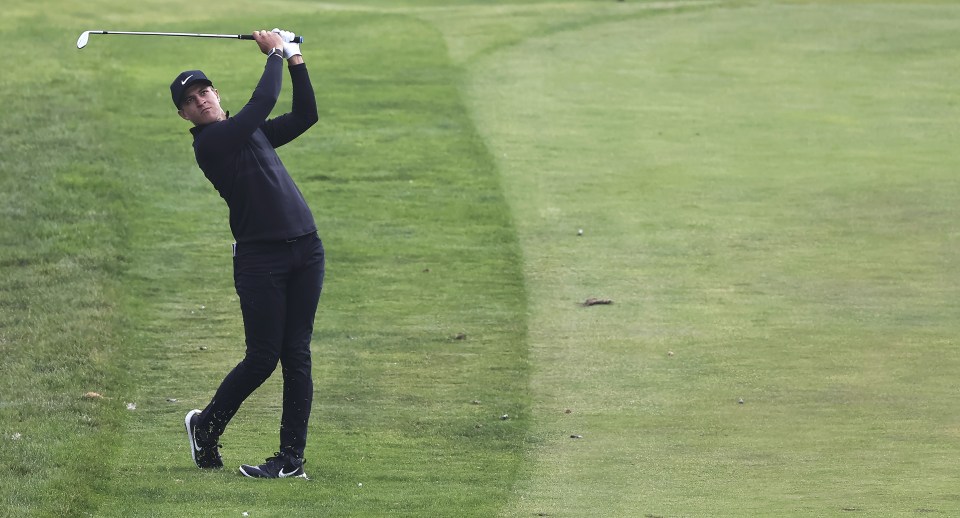 Cameron Champ, lying in second, hits a shot from just off the fairway at the 18th hole in San Francisco