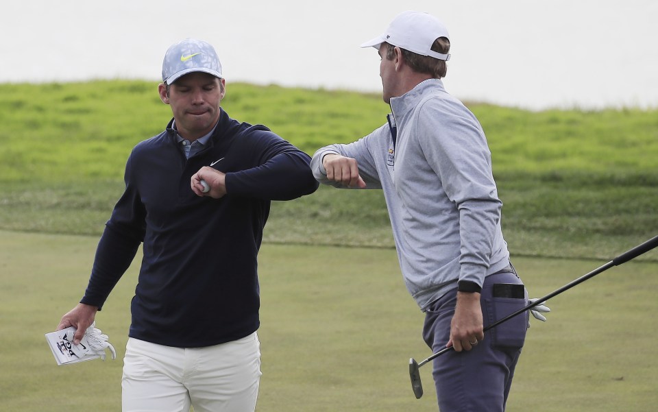 England's Paul Casey (left) and Brendon Todd keep it Covid-friendly as they congratulate each other on their rounds in San Francisco