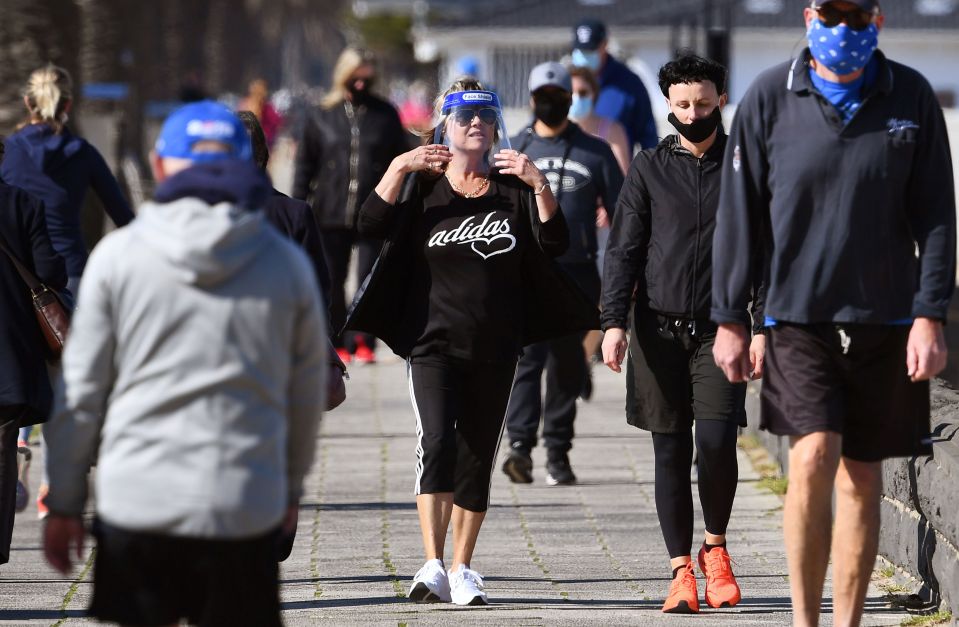  People exercise along Port Melbourne Beach before lockdown restrictions came in on August 2