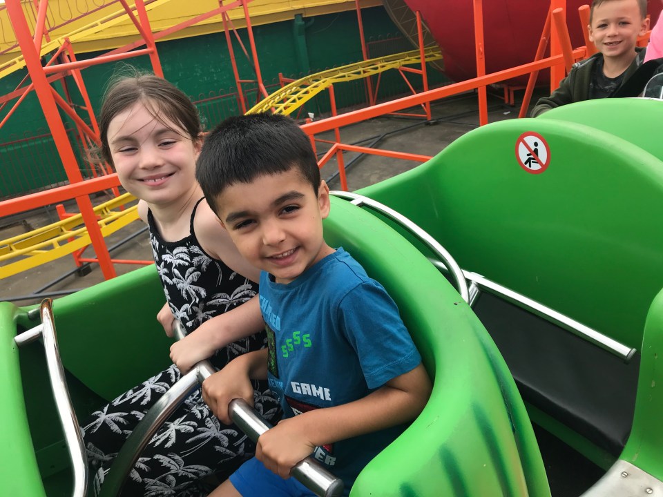 Lily and Clark ride on a rollercoaster