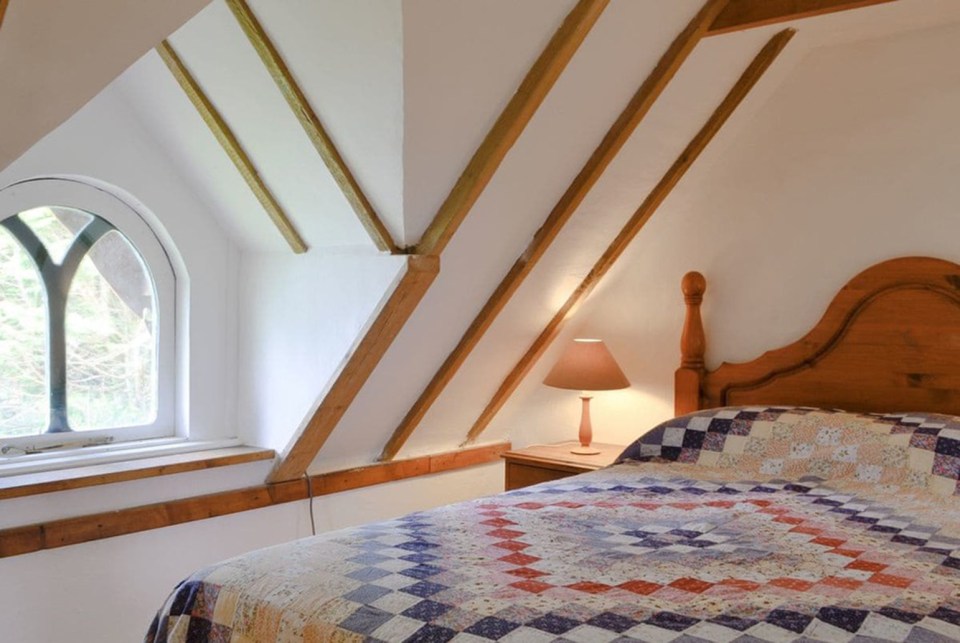 Located in the roof is the bedroom with views of the Swansea countryside