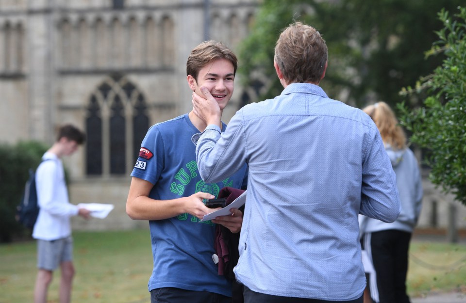 Ben Millett is congratulated by his father on his results as students at Norwich School, Norwich, receive their grades