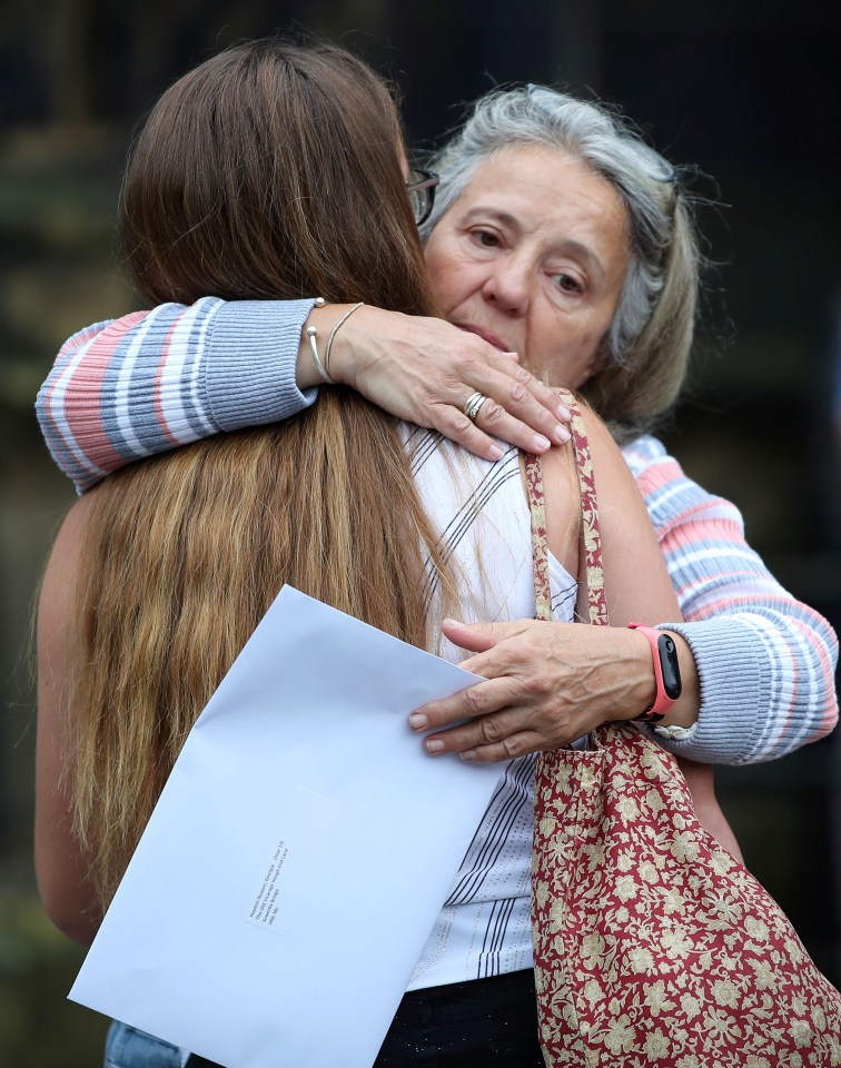 A student is hugged after getting her A-level results at The Crossley Heath Grammar School in Halifax