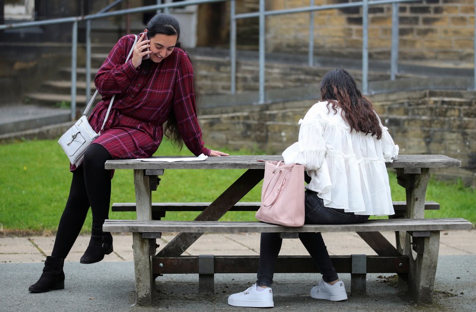 A sixth form student speaks on the phone