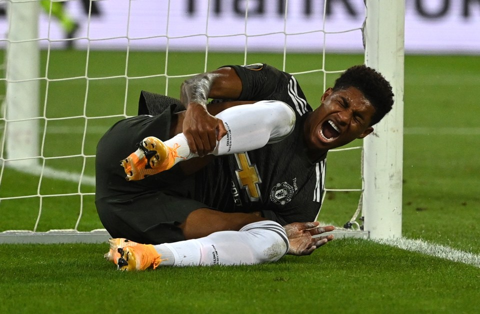 Marcus Rashford clutches his ankle against Sevilla in the Europa League semi-final