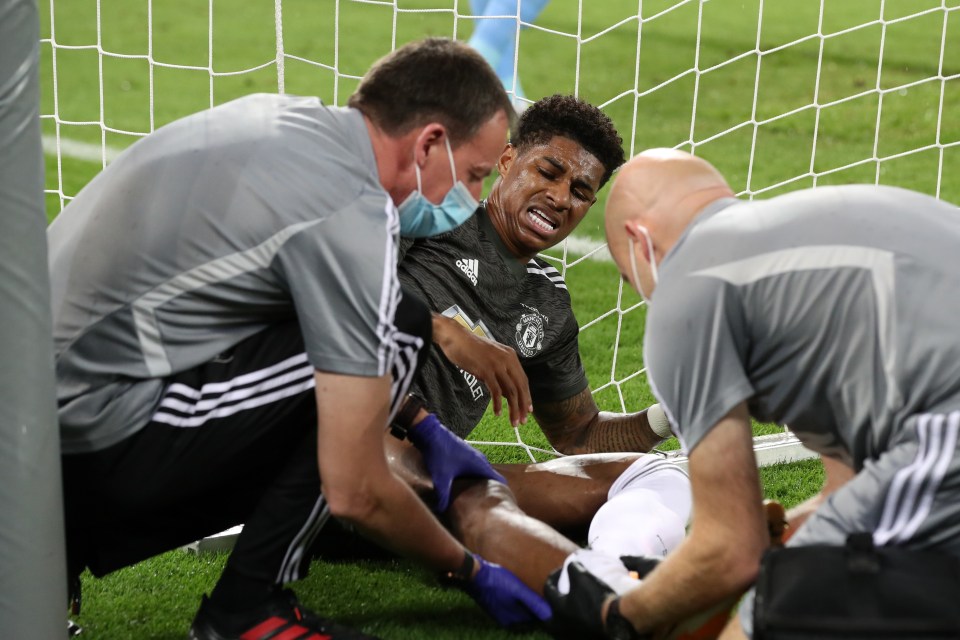 Rashford shows his discomfort as he receives medical treatment in Lisbon