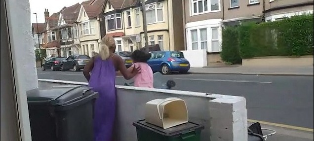 The woman appears to push the asylum seeker who moved into the property in November last year