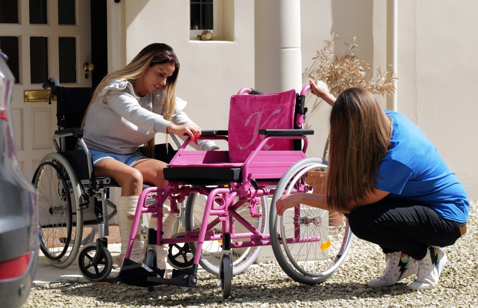 The mum of five looked delighted as she inspected the sequin-studded mobility aid