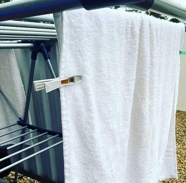 The woman pegs the sides of her washing when hanging her items up - saying it's the correct way