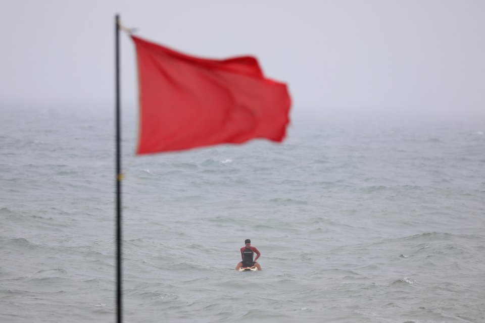 A life Guard on his paddleboard as Storm Ellen brings severe weather