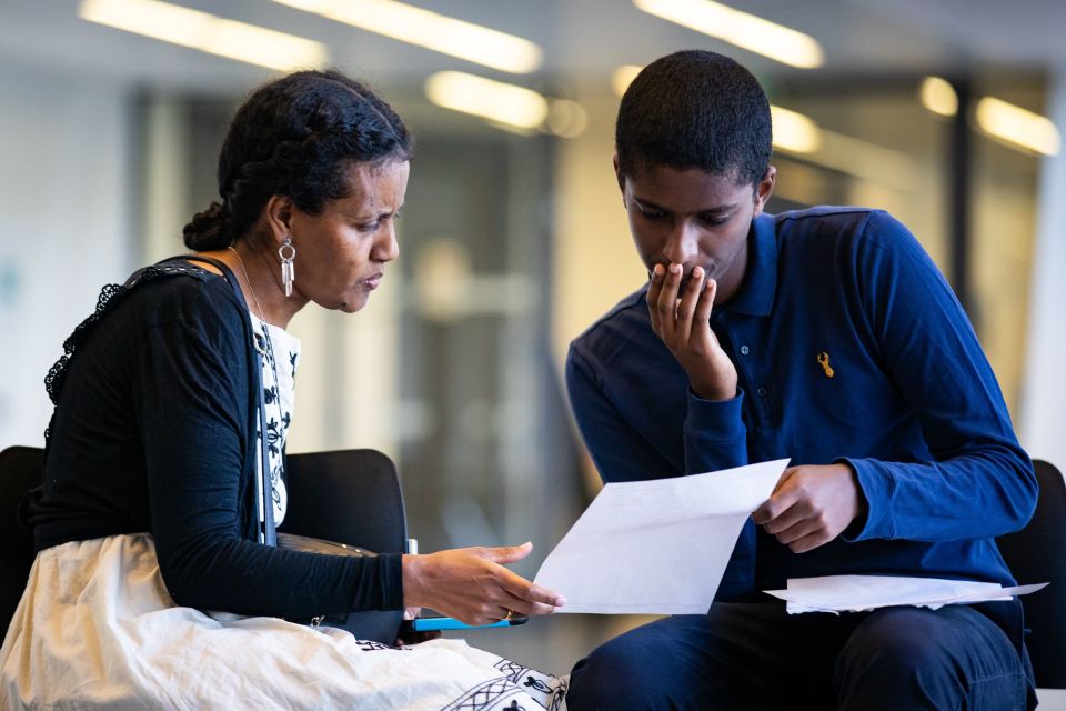 Joshua Fessahaye looked over his scores with his mum at Ark Evelyn Grace Academy