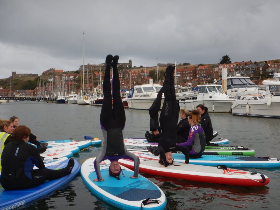 Combine yoga with paddleboarding in the middle of the River Esk