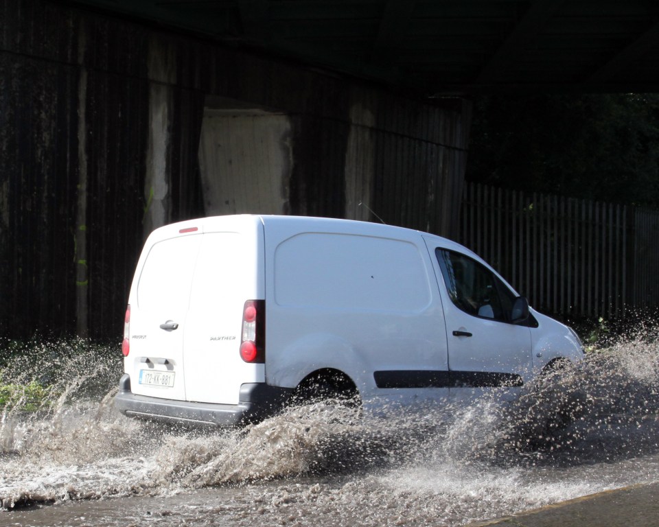 A van in Limerick drives through flooded streets after Storm Ellen hit Ireland