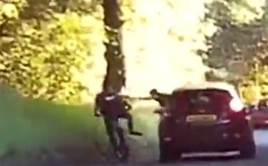 Senseless yobs shoved a schoolboy off his bike from a moving car