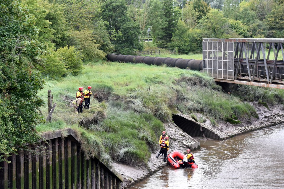 Emergency services in the River Rhymney yesterday