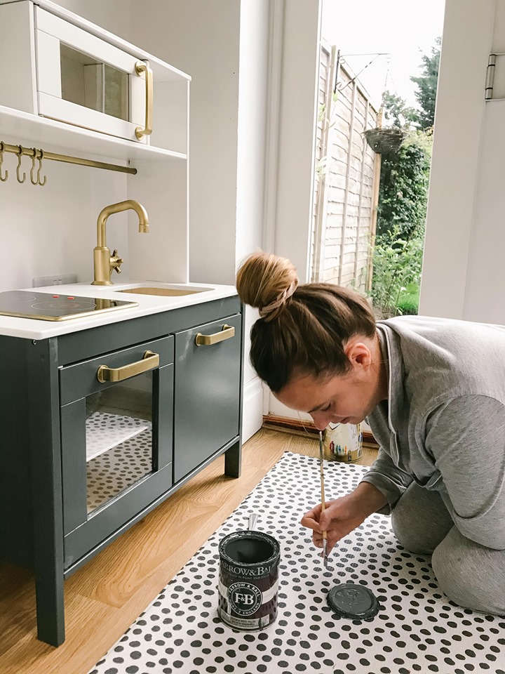 Sophie tirelessly painted the kitchen and used spray paint on the fixtures 