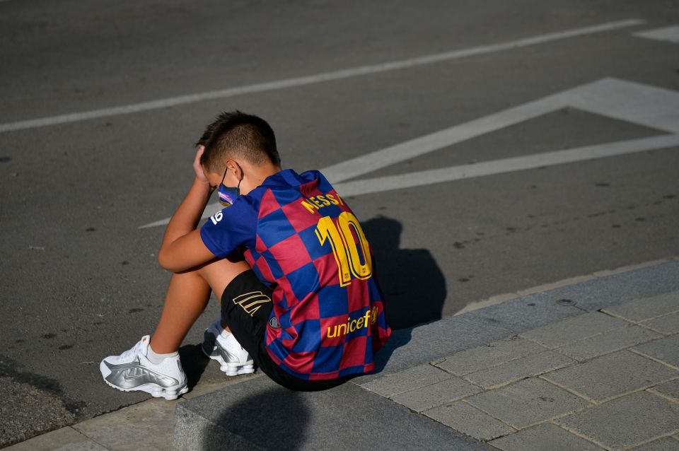 A boy looks dejected after hero Lionel Messi doesn't turn up