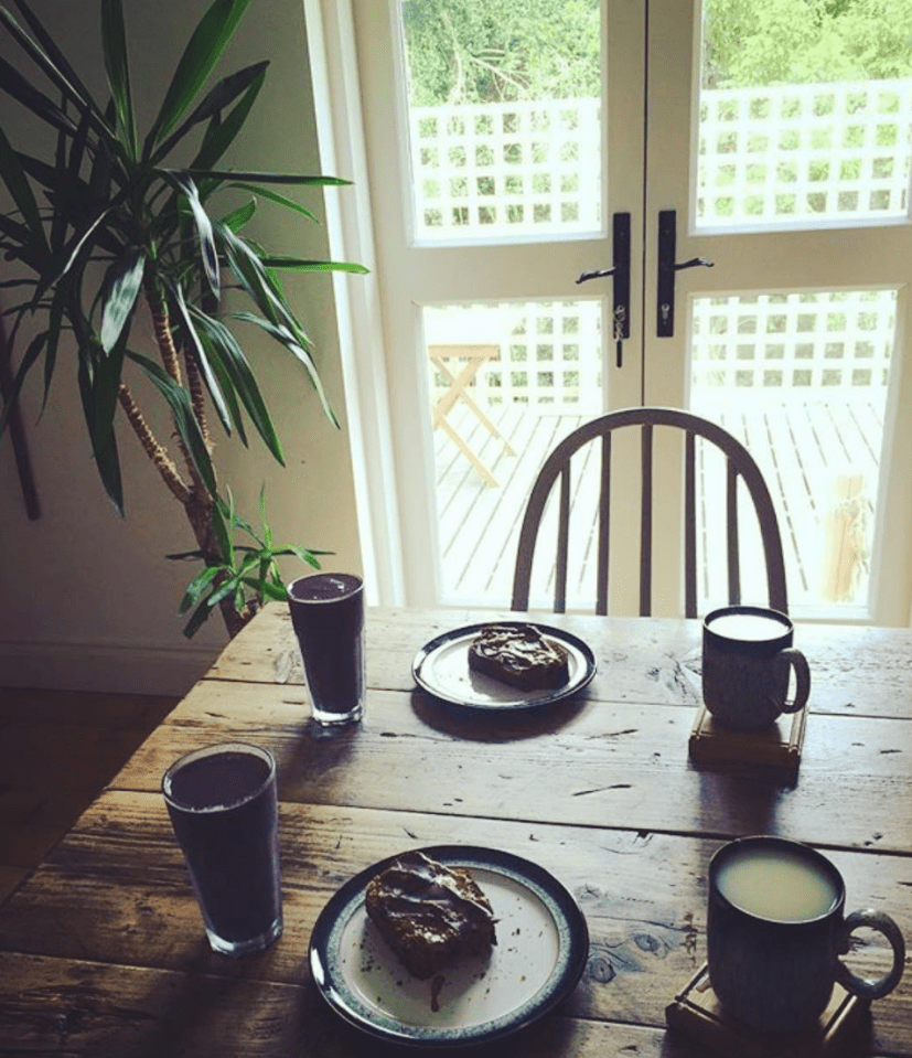 The dedicated vegan makes healthy food to serve on her heavy wooden kitchen table overlooking the backyard