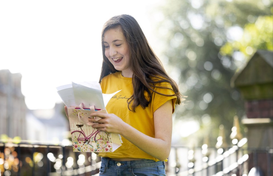 Kayla Nemeth smiles as she checks her GCSE results at Ffynone House school in Wales