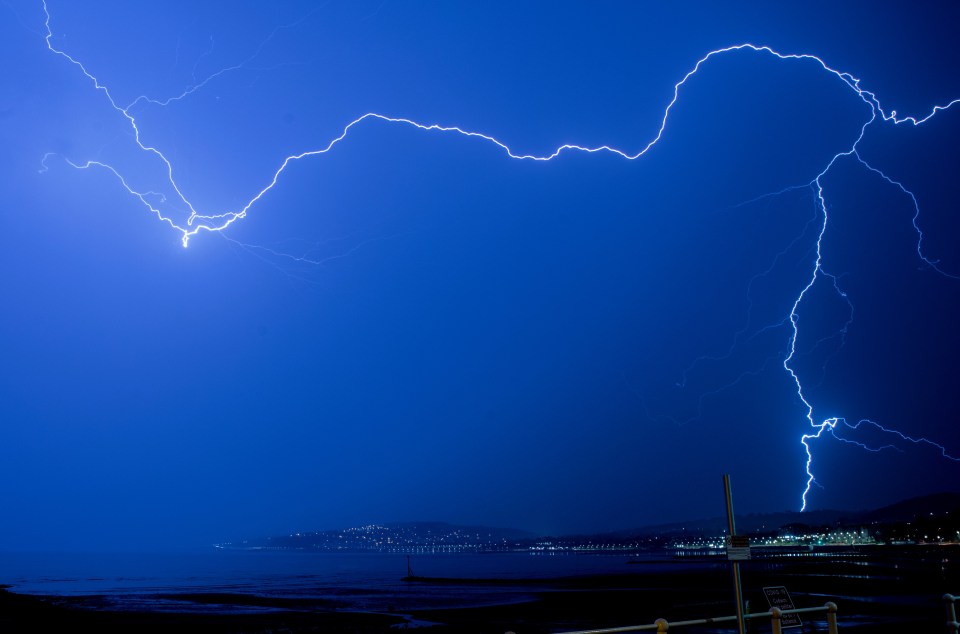 Huge thunder and lightning storm hits the mountain above Colwyn Bay on the north Wales coast