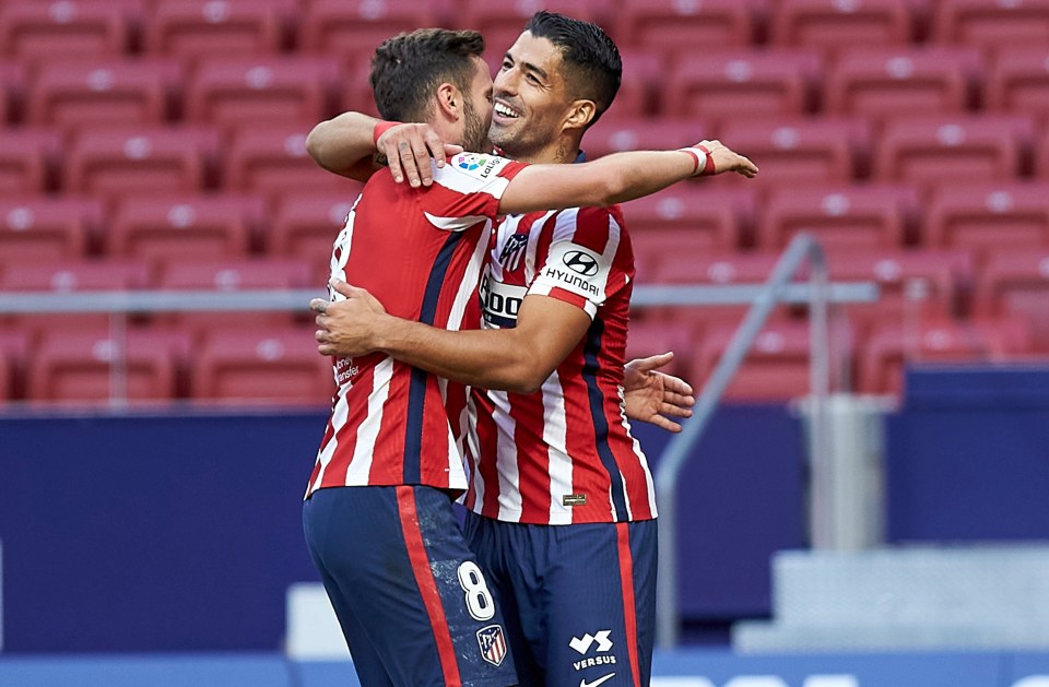 Atletico debutant Luis Suarez celebrates rounding off a 6-1 romp against Granada with his second goal as a substitute