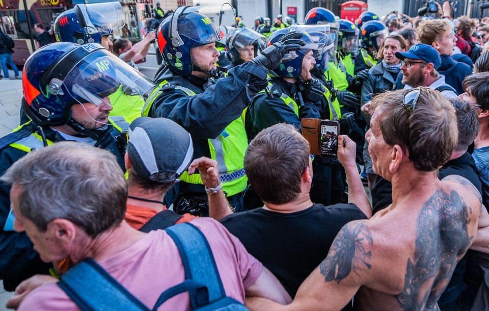 Protestors clashed with riot cops in London on Saturday afternoon