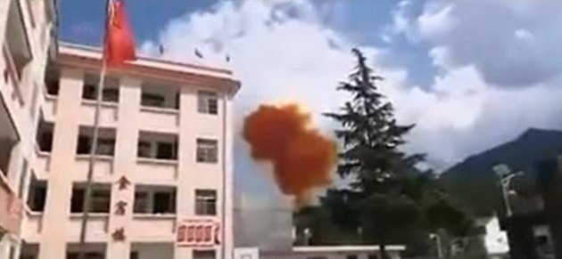 The booster plummeted to Earth following the launch of a satellite and erupted in a ball of orange smoke