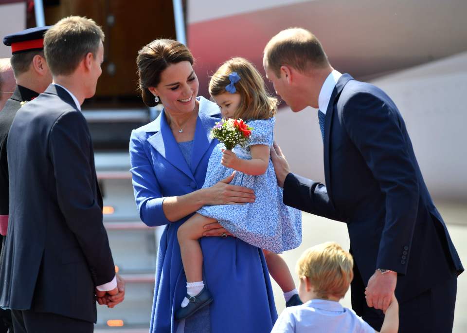 When her kids are feeling shy, Kate will often scoop them up protectively