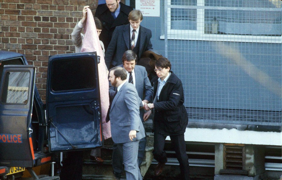 Dennis Nilsen (right), is escorted to a police van in Highgate on his way to the Old Bailey in London, February 1983