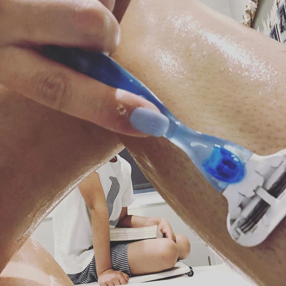 The 30-year-old shares a picture of herself shaving her legs while helping middle son Leighton with his reading