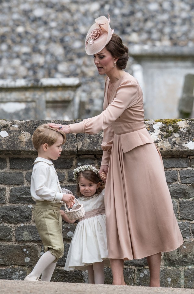 Kate gave Prince George a soft tap on the head when he was said to be playing around at Pippa Middleton’s wedding