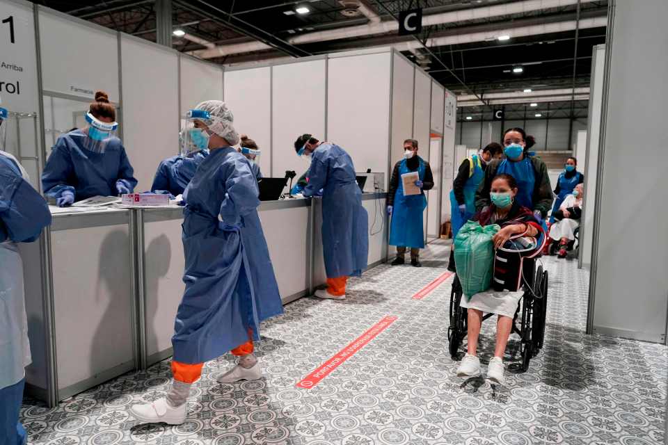 Health care workers treating Covid-19 patients at a temporary hospital in Madrid in March