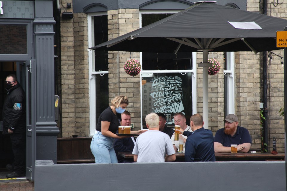 Customers enjoy a pint in Jesmond, Newcastle where pubs face a 10pm curfew