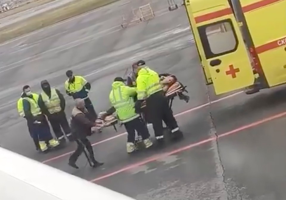 He was seen being stretchered into an ambulance