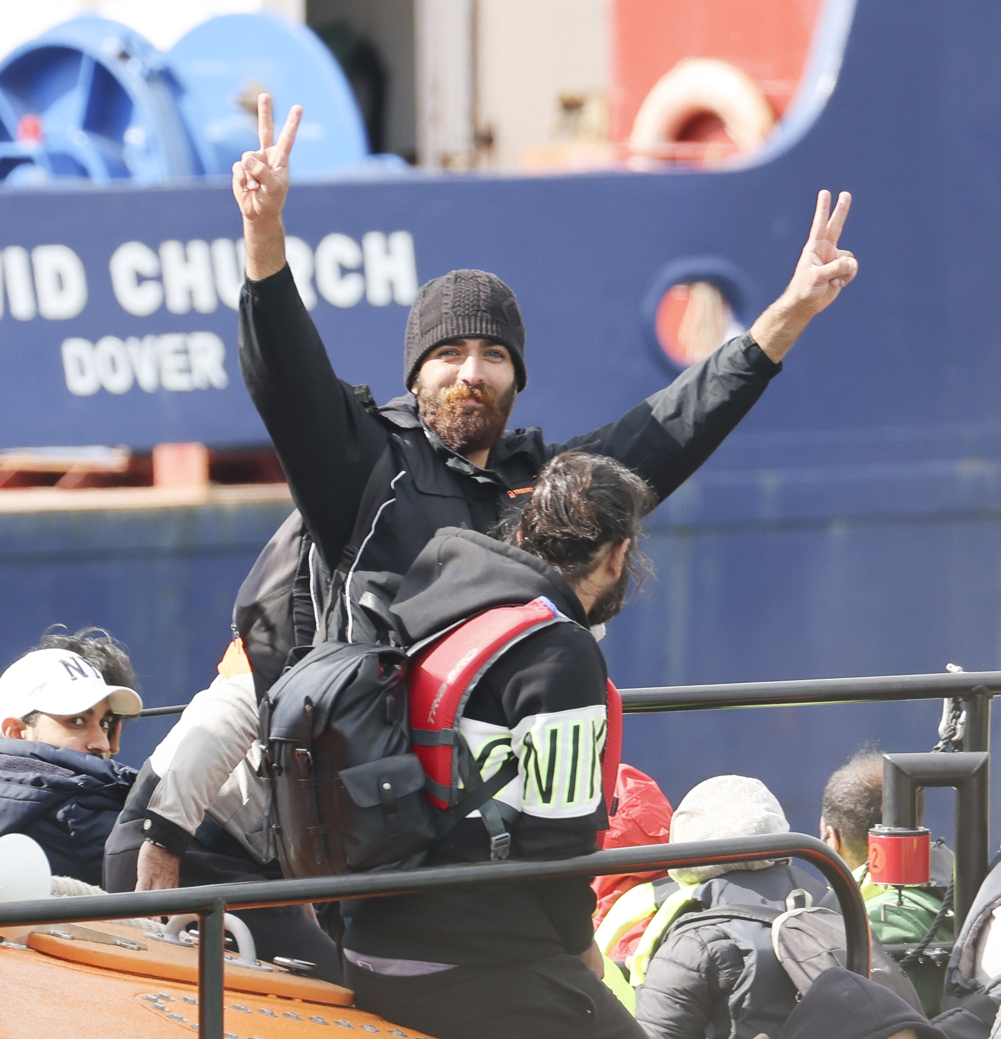 A migrant arrives in Dover yesterday during a record day for Channel crossings