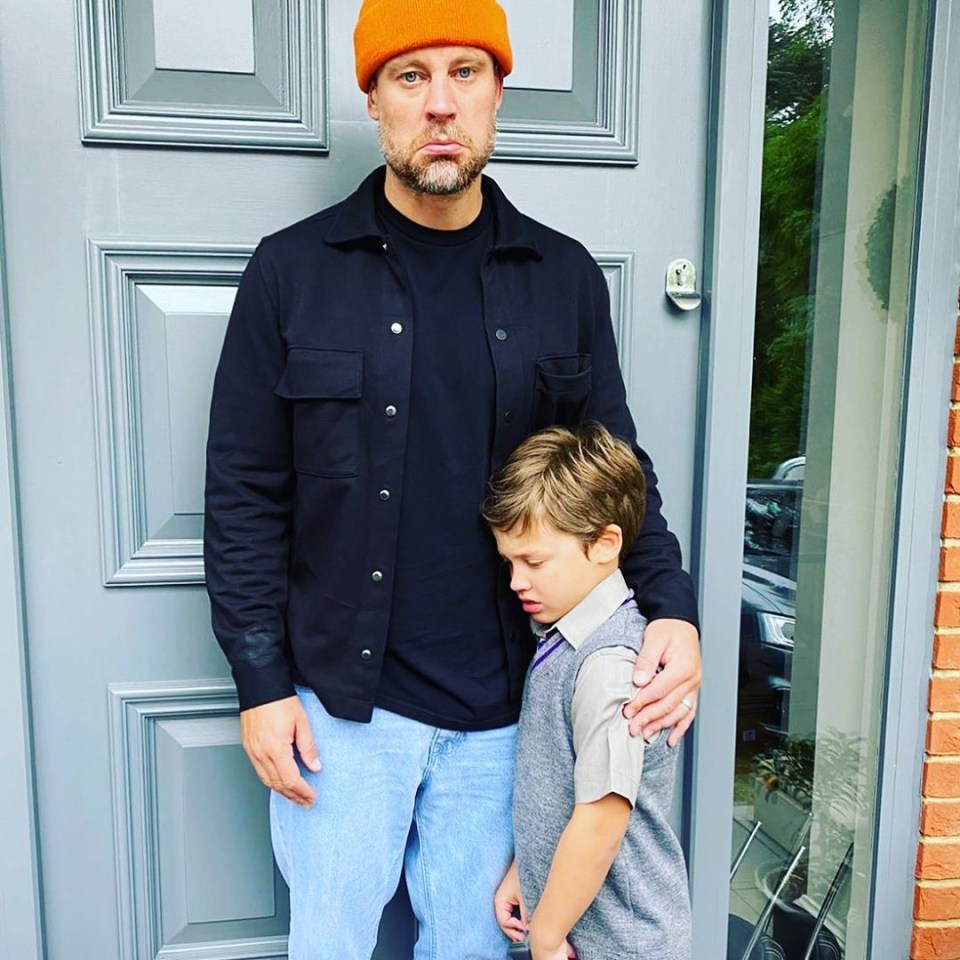 Wayne Bridge cuddles son Parker on his first day back at school