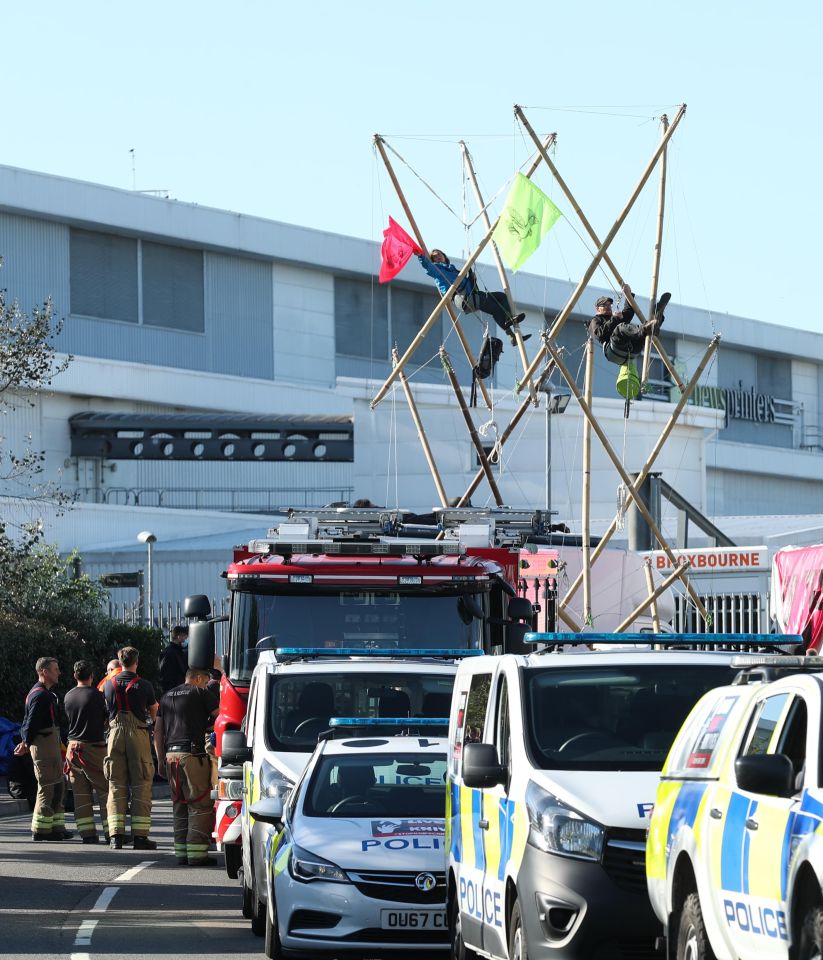 Protesters were seen in the bamboo contraption outside the printing offices