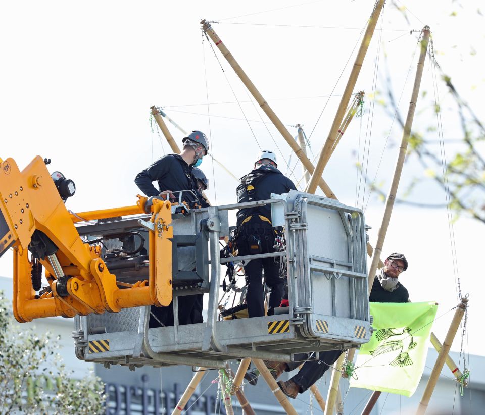 Police were called in to dismantle the bamboo lock-ons protesters are using to block the road