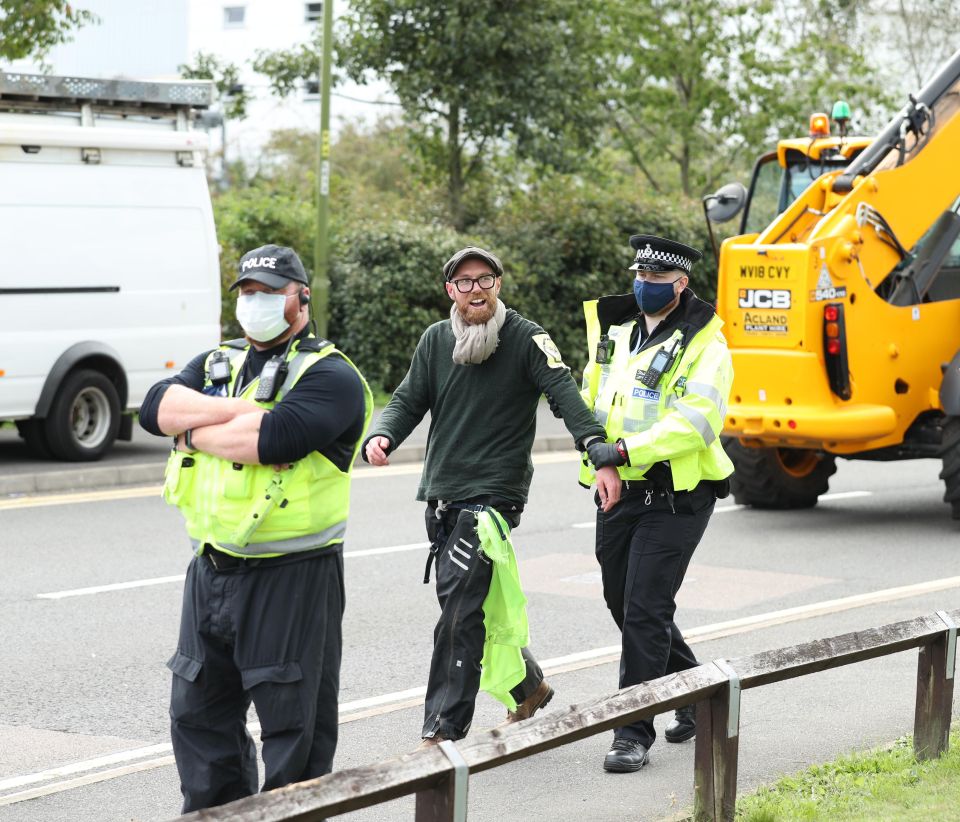 One activist is led away by police with more than 40 arrested in Hertfordshire