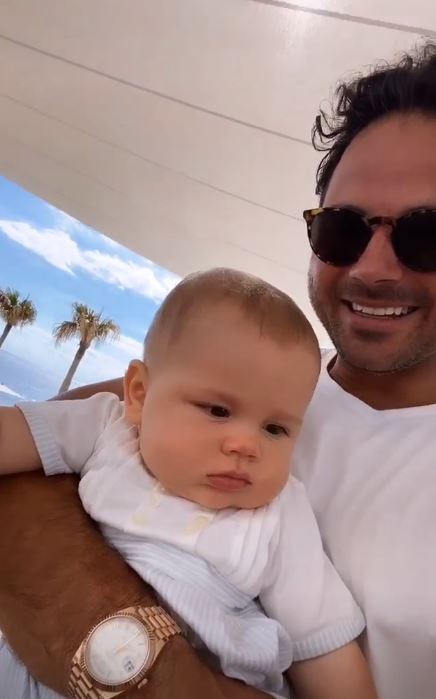 The couple are currently on holiday with son Roman