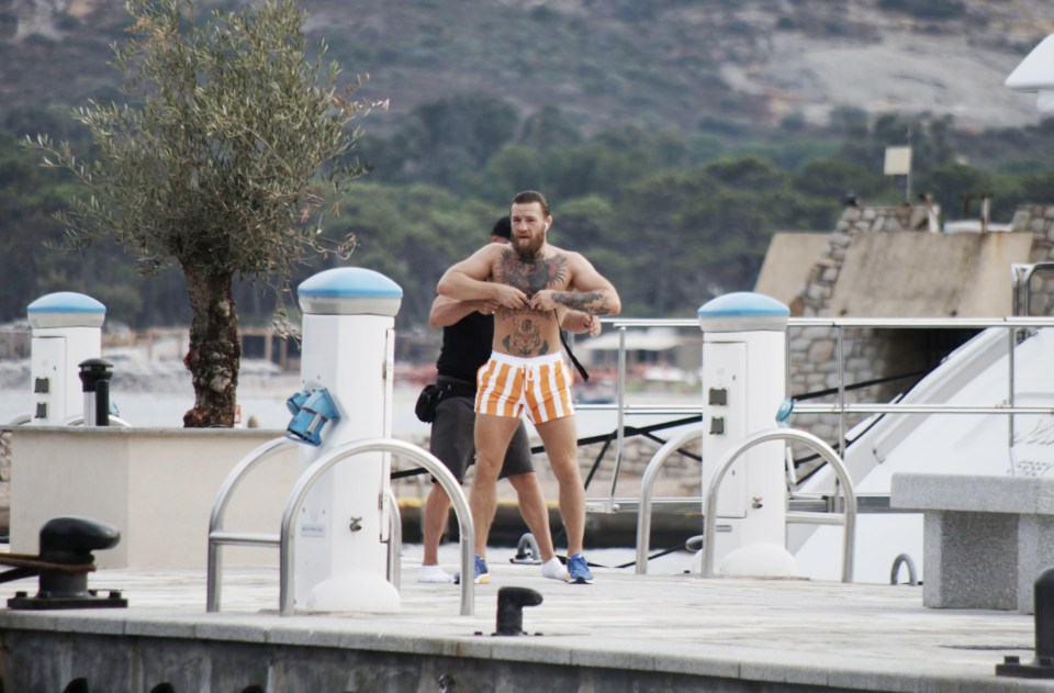 Conor McGregor was seen preparing for a jog with a trainer in Calvi, Corsica